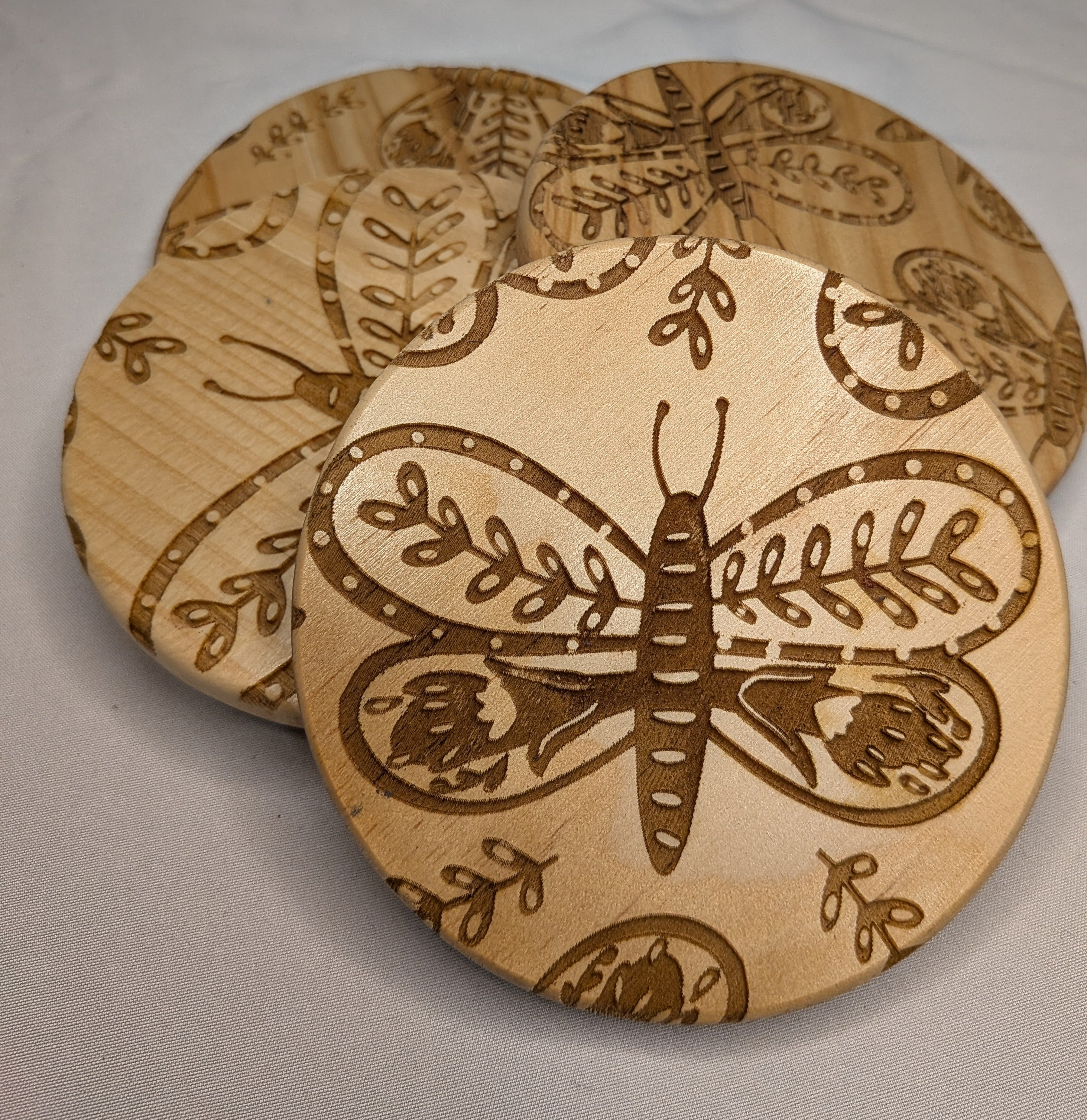 Moth engraved coasters